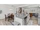 Spacious kitchen with stainless steel appliances, white cabinets, breakfast bar, and open layout at 1141 Amber Shadow Dr # 101, Durham, NC 27703