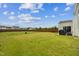 Expansive backyard with lush green grass and a wooden fence at 115 Bourne Dr, Franklinton, NC 27525