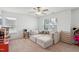 Bright bedroom featuring a large, comfortable sofa and natural light from the window at 115 Bourne Dr, Franklinton, NC 27525