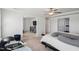 Spacious bedroom with a view into other rooms, neutral tones, and natural light from the windows at 115 Bourne Dr, Franklinton, NC 27525