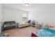 Comfortable bedroom featuring two beds and natural light from the window at 115 Bourne Dr, Franklinton, NC 27525