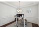 A minimal home office with white walls, a simple desk, and a comfortable chair at 115 Bourne Dr, Franklinton, NC 27525