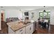 Island in kitchen with granite countertop, stainless steel sink and appliances, and an open concept floor plan at 115 Bourne Dr, Franklinton, NC 27525