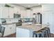 Bright kitchen featuring granite counters, white cabinets, and stainless steel appliances at 115 Bourne Dr, Franklinton, NC 27525