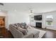Bright living room features a fireplace, mounted TV, and lots of natural light at 115 Bourne Dr, Franklinton, NC 27525