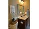 Bathroom featuring a vanity with decorative elements and a neutral color scheme at 115 Oak Leaf Trl, Youngsville, NC 27596