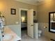 Bathroom showcasing double vanity and view to the main bedroom at 115 Oak Leaf Trl, Youngsville, NC 27596