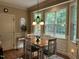 Inviting breakfast nook featuring bright natural light, wood floors, and a cozy atmosphere at 115 Oak Leaf Trl, Youngsville, NC 27596