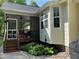 Charming home with a screened porch, beautiful garden, and stone pathway at 115 Oak Leaf Trl, Youngsville, NC 27596