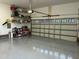 Well-organized garage with ample storage, painted epoxy floors, and an automatic door opener at 115 Oak Leaf Trl, Youngsville, NC 27596