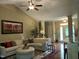 Comfortable living room featuring a plush sectional sofa, hardwood flooring, and an open layout at 115 Oak Leaf Trl, Youngsville, NC 27596