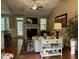 Bright living room with vaulted ceilings, a cozy fireplace, hardwood floors, and ample natural light at 115 Oak Leaf Trl, Youngsville, NC 27596