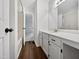 Well-lit bathroom with white cabinets, a large mirror, and a shower/tub at 122 Mallard Ct, Chapel Hill, NC 27517
