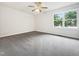 Comfortable bedroom with a large window, neutral colors, and plush carpet at 122 Mallard Ct, Chapel Hill, NC 27517