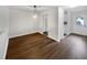 Dining room showcasing wood floors and a view into the kitchen and entryway at 122 Mallard Ct, Chapel Hill, NC 27517