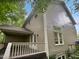 Exterior view of home showing the siding and deck, surrounded by mature trees at 122 Mallard Ct, Chapel Hill, NC 27517
