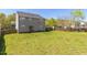Expansive backyard featuring a lush lawn, privacy fence, and mature trees at 1220 Marbank St, Wake Forest, NC 27587