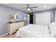 Comfortable bedroom featuring neutral walls, white dresser, and a view of the closet at 1220 Marbank St, Wake Forest, NC 27587