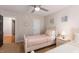Bright bedroom with twin beds, neutral walls, and ample natural light at 1220 Marbank St, Wake Forest, NC 27587