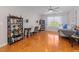 Large bonus room with desk, bookcase, ceiling fan, and natural light at 1220 Marbank St, Wake Forest, NC 27587