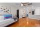 Hardwood bonus room with decorative painting, adjacent bedrooms, plus a ceiling fan at 1220 Marbank St, Wake Forest, NC 27587