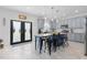 Bright kitchen featuring a central island, modern appliances, and direct access to the backyard at 1220 Marbank St, Wake Forest, NC 27587