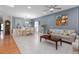 Open-concept living and dining area with hardwood floors and modern decor at 1220 Marbank St, Wake Forest, NC 27587