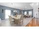 Open-concept living space featuring a comfortable seating area and elegant dining set at 1220 Marbank St, Wake Forest, NC 27587