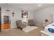 Sitting area in carpeted main bedroom with access to ensuite bath and carpeted floor at 1220 Marbank St, Wake Forest, NC 27587