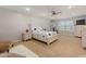 Cozy main bedroom with carpet, white furniture, ceiling fan, and natural light at 1220 Marbank St, Wake Forest, NC 27587