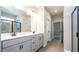 Bright bathroom showcasing double vanity, framed mirrors, tiled floors and glass shower at 1234 Pioneer Lot 3 Dr, Sanford, NC 27330