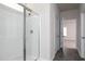 Bathroom featuring tiled floors, white shower stall and a doorway to the bedroom at 1234 Pioneer Lot 3 Dr, Sanford, NC 27330