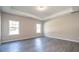 Light-filled room featuring recessed lights, tray ceilings, and two large windows at 1234 Pioneer Lot 3 Dr, Sanford, NC 27330