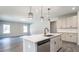 Kitchen and living area with stainless steel appliances, granite countertops and light, neutral paint at 1234 Pioneer Lot 3 Dr, Sanford, NC 27330