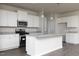 New kitchen with stainless steel appliances, granite countertops, and an island with a bar at 1234 Pioneer Lot 3 Dr, Sanford, NC 27330