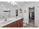 This bathroom features dual sinks, ample lighting, and tile floors at 1287 Salters St, Burlington, NC 27215