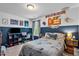 This bedroom has a large bed and a blue accent wall that gives the room style and personality at 1287 Salters St, Burlington, NC 27215