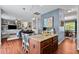This kitchen offers granite counters, stainless steel appliances, and seamless access to the dining area and living room at 1287 Salters St, Burlington, NC 27215
