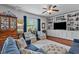Inviting living room featuring built-in shelving, lots of natural light, and comfortable seating at 1287 Salters St, Burlington, NC 27215