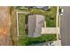 Overhead view of a two-story home with a fenced-in yard, patio, and driveway at 135 Campaign Dr, Mebane, NC 27302