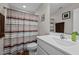 Cozy bathroom featuring a shower with a colorful shower curtain and modern fixtures at 135 Campaign Dr, Mebane, NC 27302
