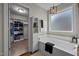 Bright bathroom features a soaking tub with a view and a huge walk in closet at 135 Campaign Dr, Mebane, NC 27302