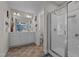 The bright bathroom features double sink vanity, a large mirror, and a walk in shower at 135 Campaign Dr, Mebane, NC 27302