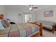 Cozy bedroom featuring wood furnishings, ceiling fan and large windows with coverings at 135 Campaign Dr, Mebane, NC 27302
