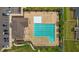 Aerial view of a community pool, clubhouse, and parking lot at 135 Campaign Dr, Mebane, NC 27302