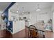 Bright kitchen featuring granite countertops, stainless appliances, and a connected dining area at 135 Campaign Dr, Mebane, NC 27302