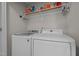 Functional laundry room features a washer, dryer, and above shelf storage at 135 Campaign Dr, Mebane, NC 27302