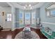 Cozy playroom with a round rug, ample natural light from the windows, and a variety of toys at 135 Campaign Dr, Mebane, NC 27302