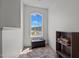 Charming reading nook with a window view, comfortable seating, and built in shelving at 135 Campaign Dr, Mebane, NC 27302