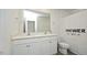 Bathroom featuring double vanity, a large mirror, and a shower-tub at 139 Palm Drive Dr, Sanford, NC 27332